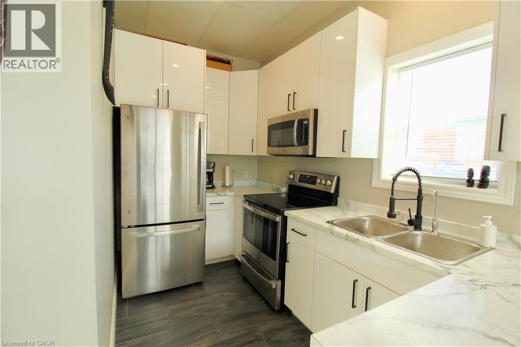 Multi-family at 7 BEECH Street, St. Catharines, Ontario - Photo 5 - RE/MAX Garden City Realty