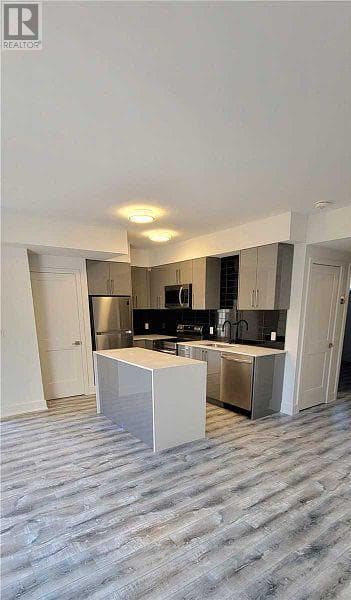 Single Family at 102- 6065 McLEOD Road, Niagara Falls (Arad/Fallsview), Ontario - Photo 3 - RE/MAX Garden City Realty