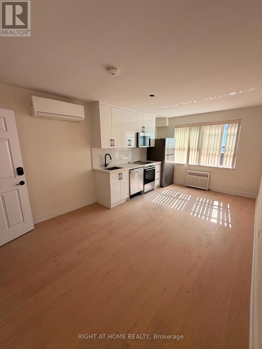 Multi-family at 202- 3384 Lake Shore Boulevard, Toronto (Long Branch), Ontario - Photo 2 - RE/MAX Garden City Realty