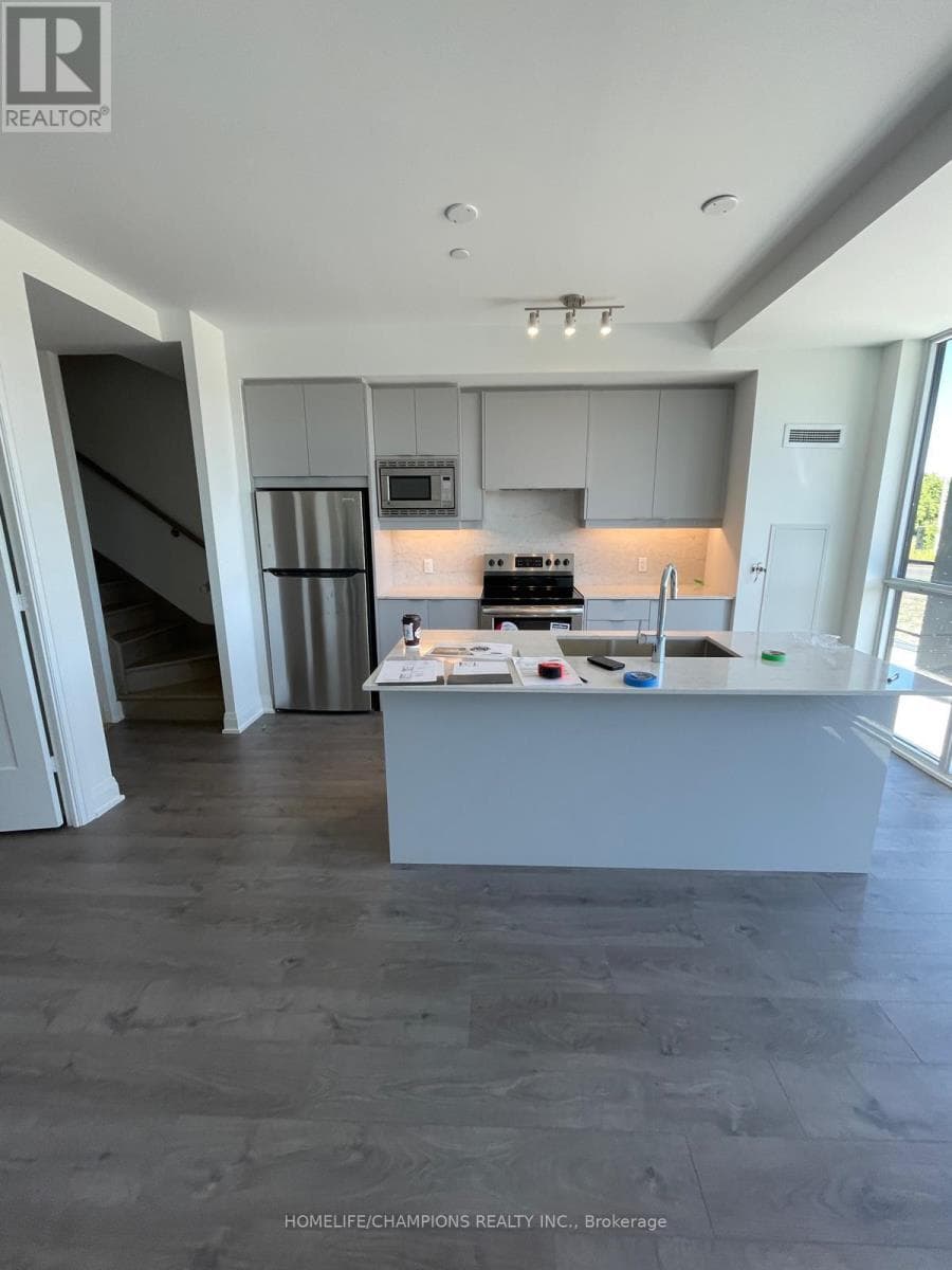 Single Family at 5- 60 George Butchart Drive, Toronto (Downsview-Roding-CFB), Ontario - Photo 3 - RE/MAX Garden City Realty