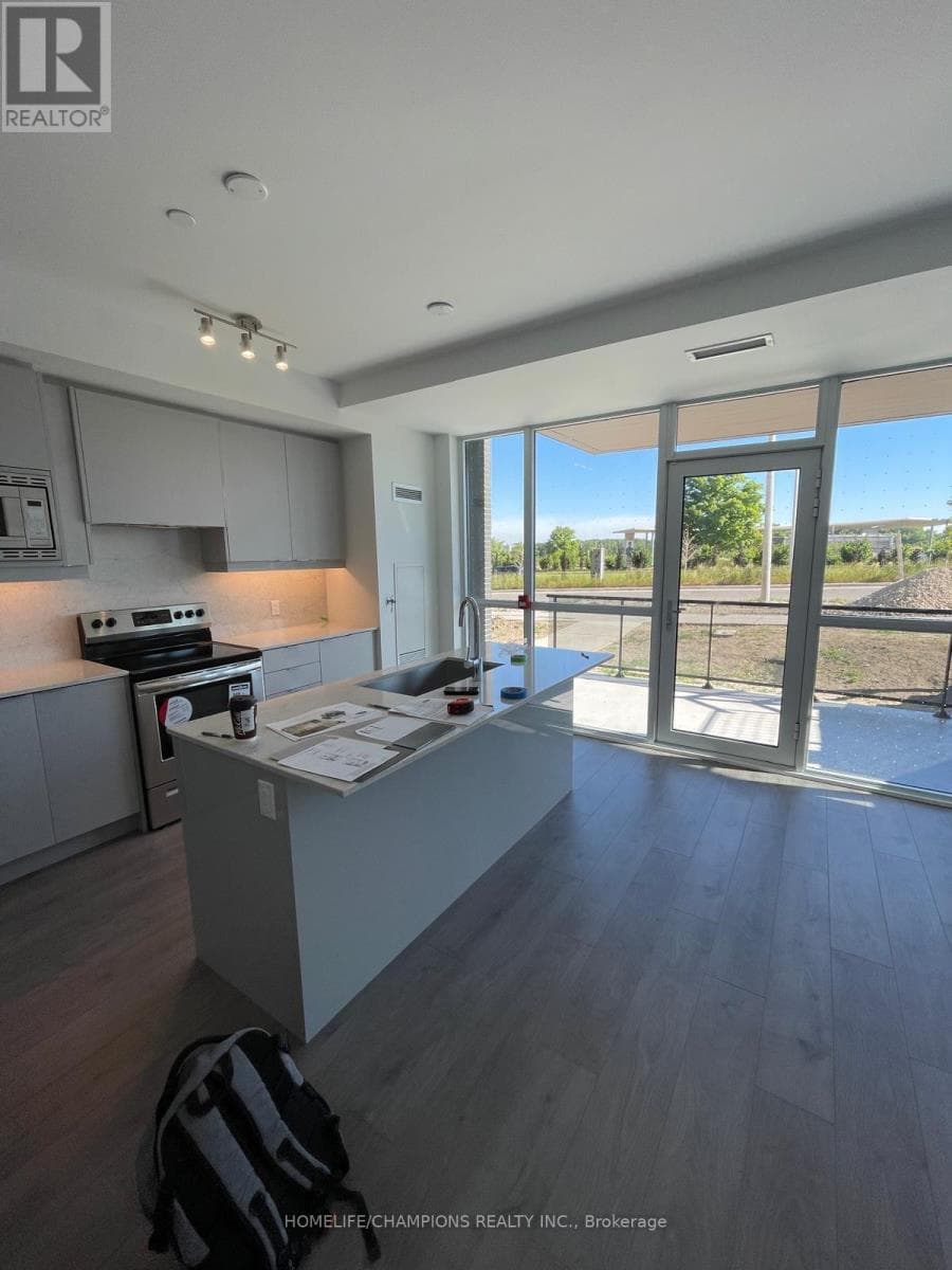 Single Family at 5- 60 George Butchart Drive, Toronto (Downsview-Roding-CFB), Ontario - Photo 4 - RE/MAX Garden City Realty