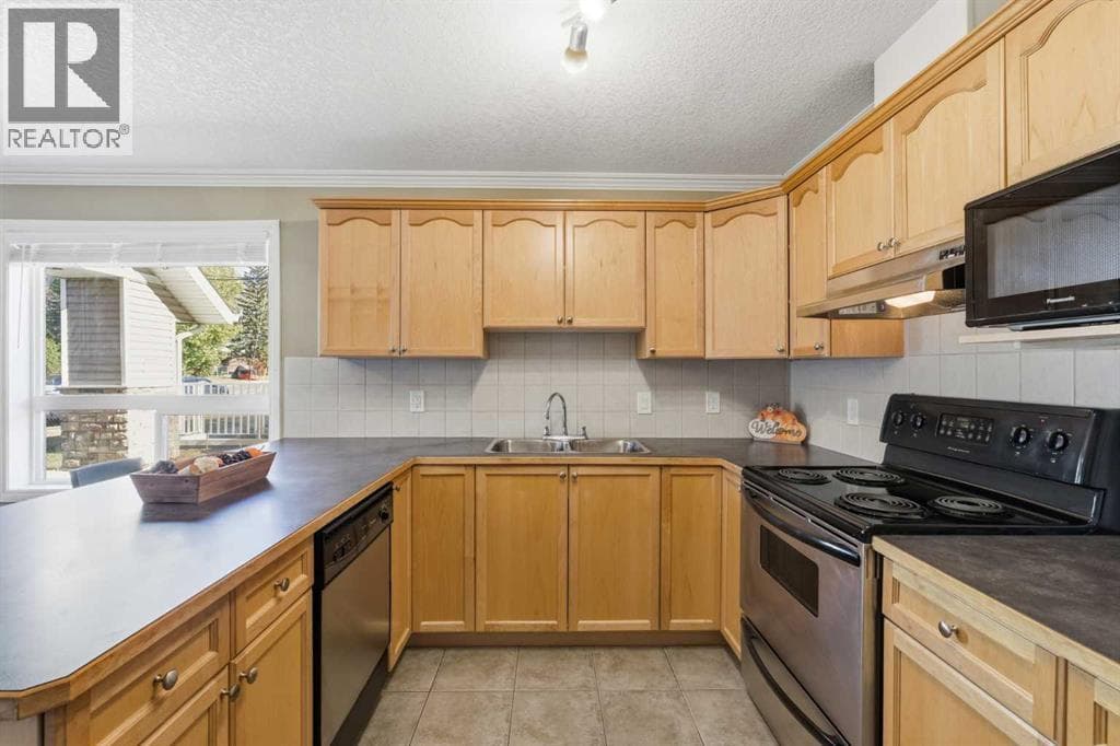 Single Family at 128 Centre Avenue, Cochrane, Alberta - Photo 9 - RE/MAX Garden City Realty