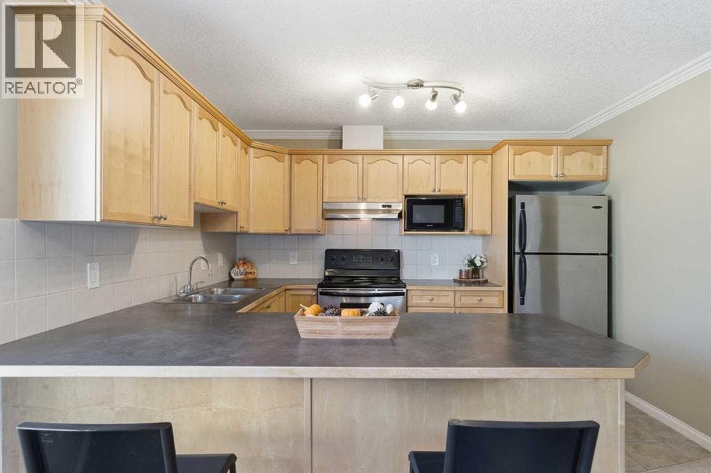 Single Family at 128 Centre Avenue, Cochrane, Alberta - Photo 8 - RE/MAX Garden City Realty