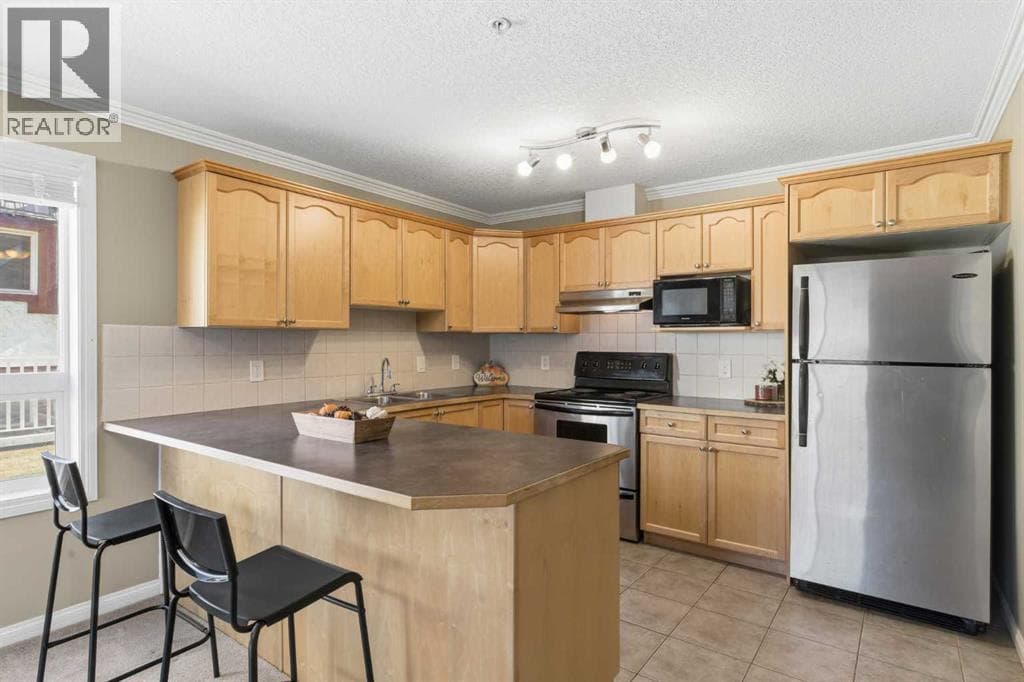 Single Family at 128 Centre Avenue, Cochrane, Alberta - Photo 10 - RE/MAX Garden City Realty