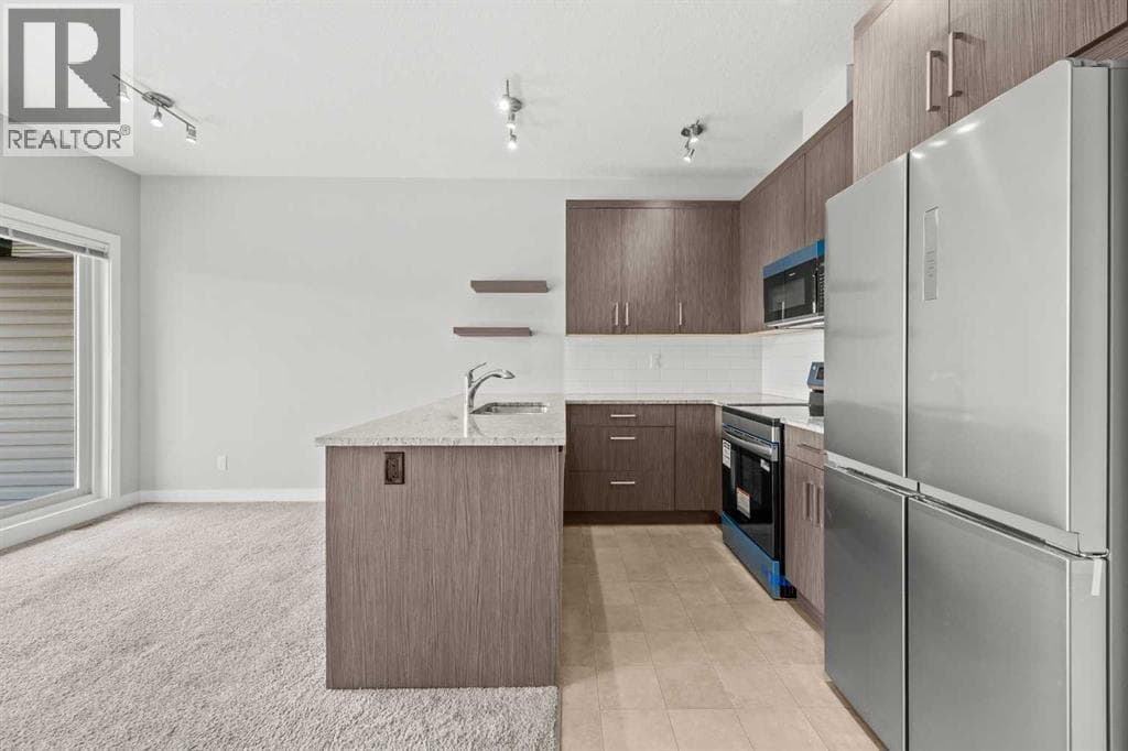 Single Family at 304 Jumping Pound Common, Cochrane, Alberta - Photo 9 - RE/MAX Garden City Realty