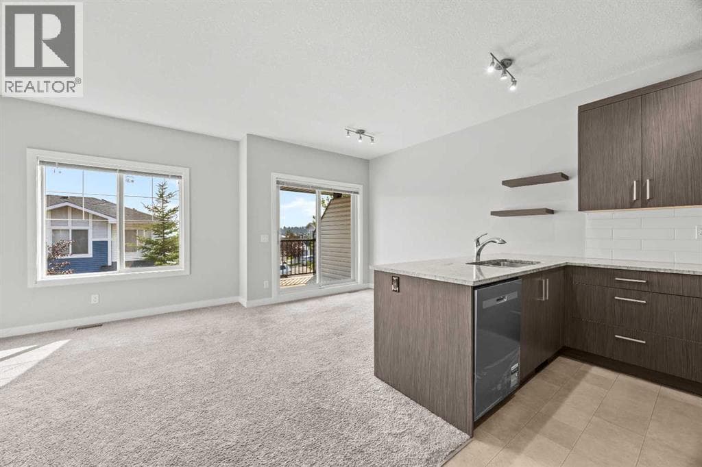 Single Family at 304 Jumping Pound Common, Cochrane, Alberta - Photo 10 - RE/MAX Garden City Realty