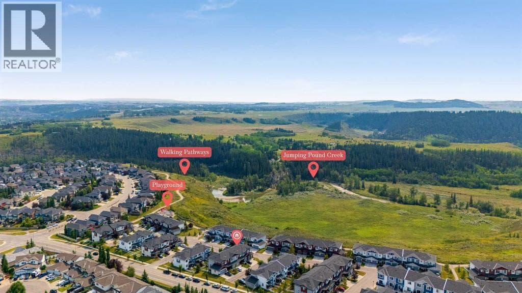 Single Family at 304 Jumping Pound Common, Cochrane, Alberta - Photo 4 - RE/MAX Garden City Realty