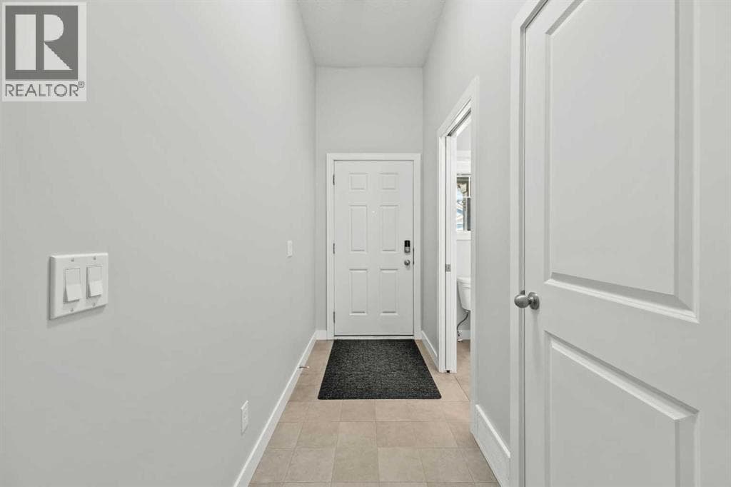 Single Family at 304 Jumping Pound Common, Cochrane, Alberta - Photo 5 - RE/MAX Garden City Realty