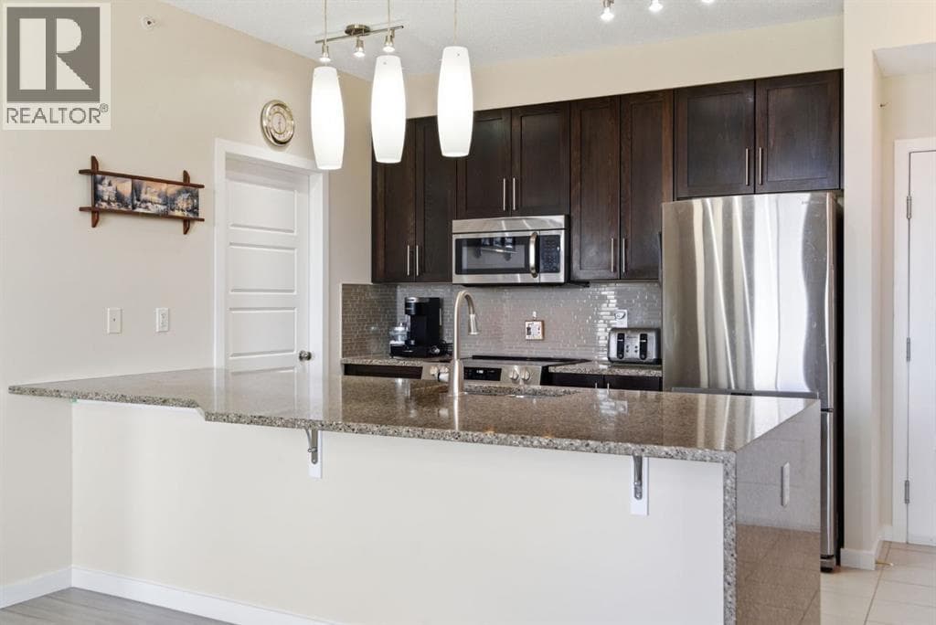Single Family at 207 Sunset Drive, Cochrane, Alberta - Photo 4 - RE/MAX Garden City Realty
