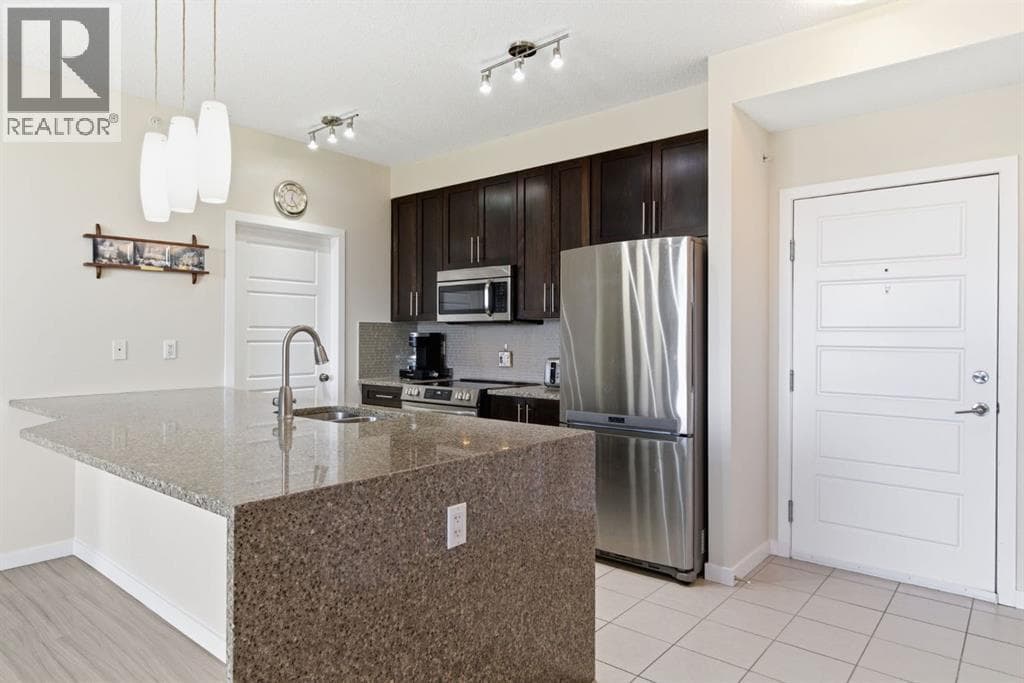 Single Family at 207 Sunset Drive, Cochrane, Alberta - Photo 7 - RE/MAX Garden City Realty