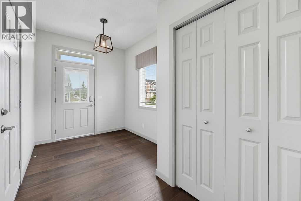 Single Family at 590 River Heights Crescent, Cochrane, Alberta - Photo 4 - RE/MAX Garden City Realty