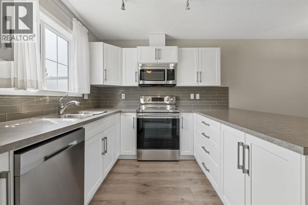 Single Family at 268 Sunset Road, Cochrane, Alberta - Photo 5 - RE/MAX Garden City Realty
