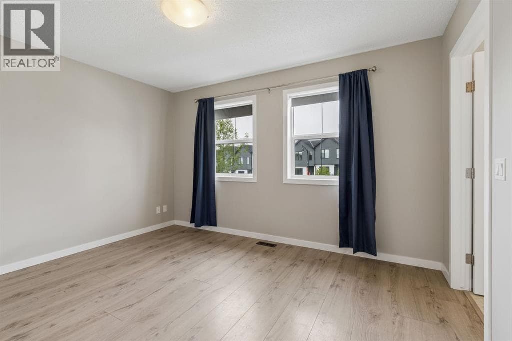Single Family at 268 Sunset Road, Cochrane, Alberta - Photo 8 - RE/MAX Garden City Realty