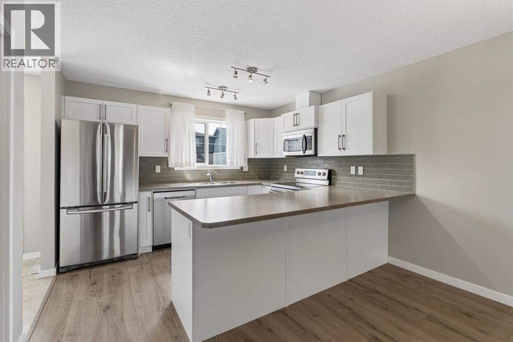 Single Family at 268 Sunset Road, Cochrane, Alberta - Photo 4 - RE/MAX Garden City Realty