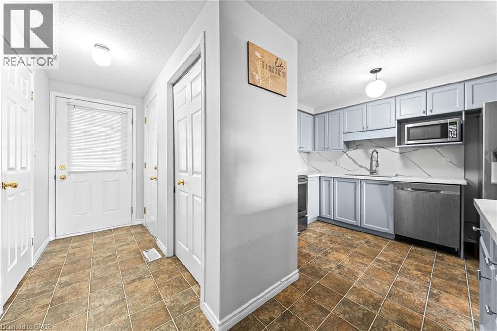 Single Family at 245 RED CLOVER Court, Kitchener, Ontario - Photo 6 - RE/MAX Garden City Realty