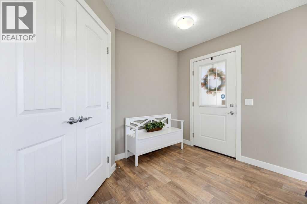 Single Family at 115 Heartland Boulevard, Cochrane, Alberta - Photo 3 - RE/MAX Garden City Realty