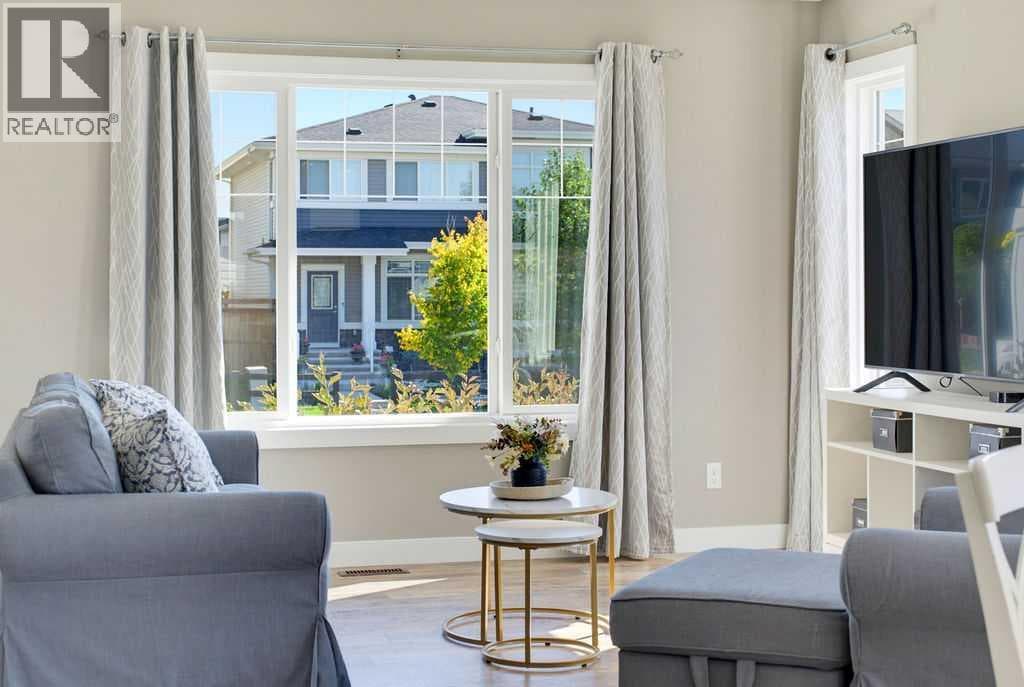 Single Family at 115 Heartland Boulevard, Cochrane, Alberta - Photo 6 - RE/MAX Garden City Realty