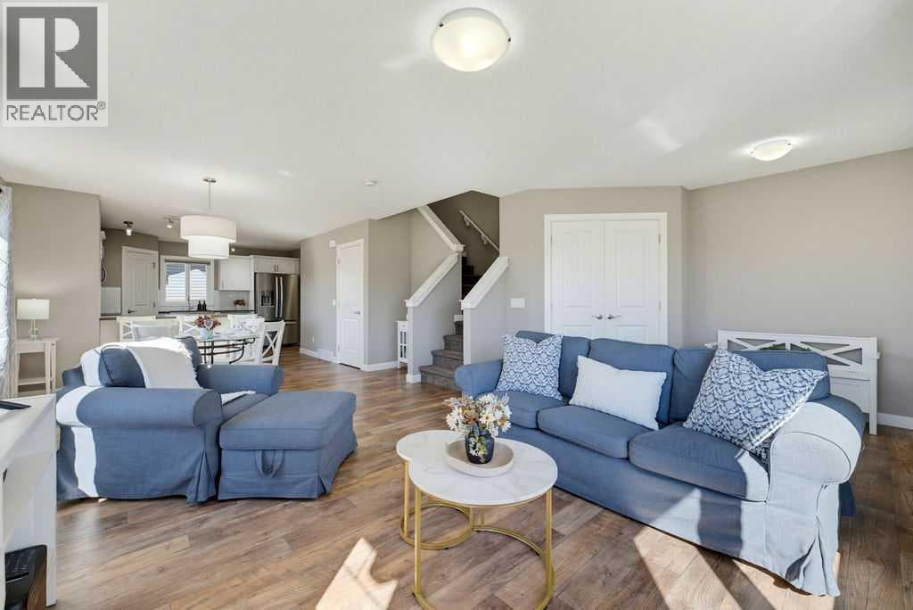 Single Family at 115 Heartland Boulevard, Cochrane, Alberta - Photo 7 - RE/MAX Garden City Realty