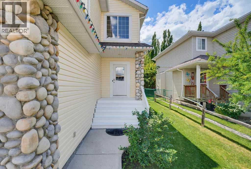 Single Family at 11 Bow Ridge Link, Cochrane, Alberta - Photo 2 - RE/MAX Garden City Realty