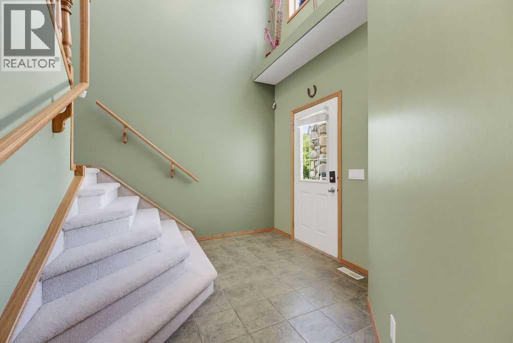 Single Family at 11 Bow Ridge Link, Cochrane, Alberta - Photo 3 - RE/MAX Garden City Realty