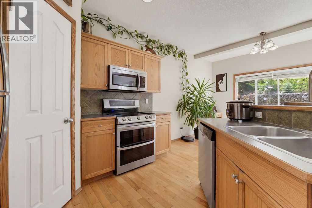 Single Family at 11 Bow Ridge Link, Cochrane, Alberta - Photo 5 - RE/MAX Garden City Realty