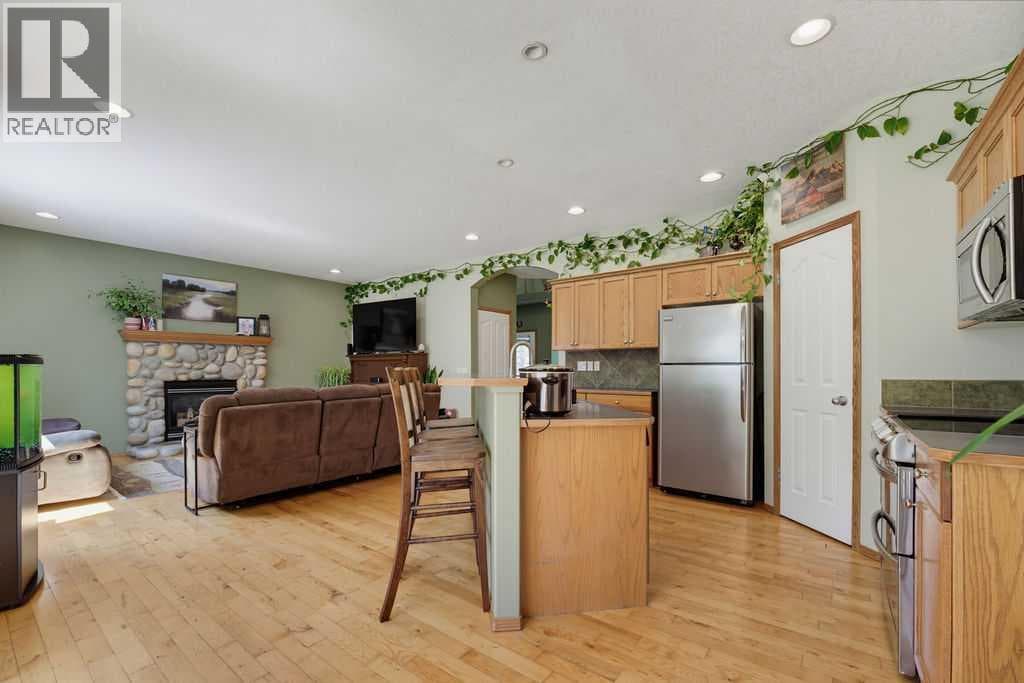 Single Family at 11 Bow Ridge Link, Cochrane, Alberta - Photo 7 - RE/MAX Garden City Realty