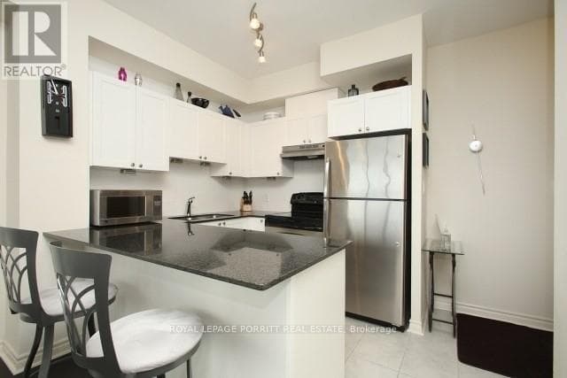 Single Family at 1109- 3865 Lake Shore Boulevard, Toronto (Long Branch), Ontario - Photo 3 - RE/MAX Garden City Realty