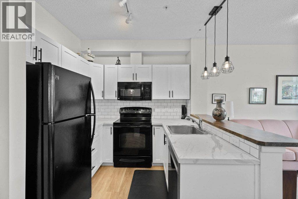 Single Family at 201 Sunset Drive, Cochrane, Alberta - Photo 9 - RE/MAX Garden City Realty