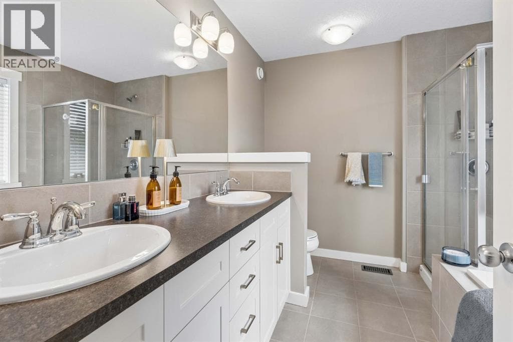Single Family at 144 Sunrise View, Cochrane, Alberta - Photo 9 - RE/MAX Garden City Realty