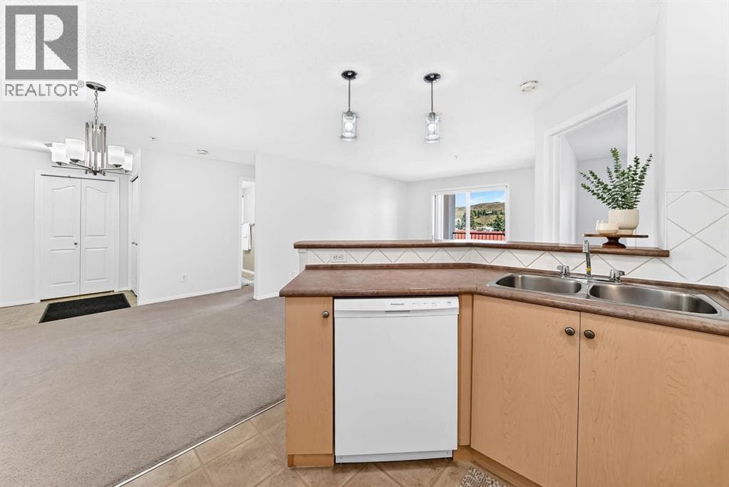 Single Family at 505 Railway Street, Cochrane, Alberta - Photo 5 - RE/MAX Garden City Realty