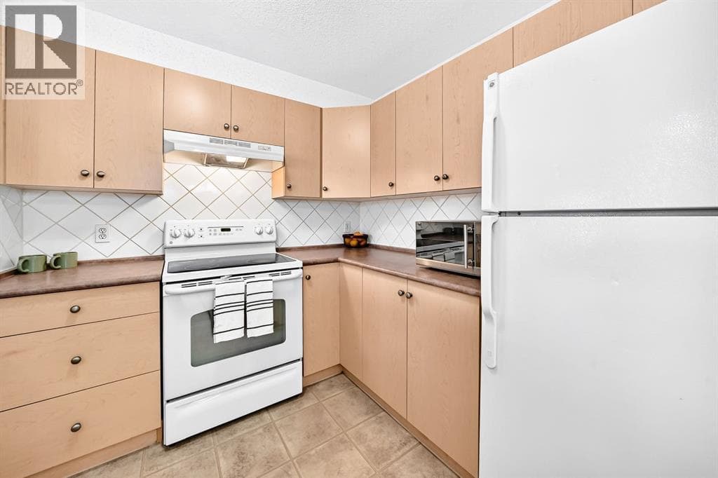 Single Family at 505 Railway Street, Cochrane, Alberta - Photo 4 - RE/MAX Garden City Realty