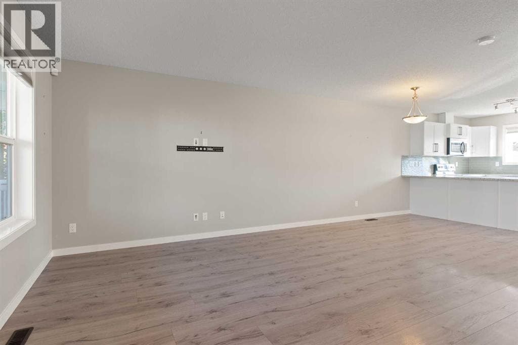 Single Family at 276 Sunset Road, Cochrane, Alberta - Photo 8 - RE/MAX Garden City Realty
