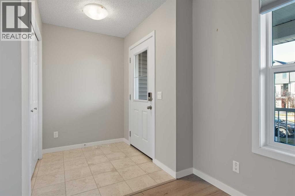Single Family at 276 Sunset Road, Cochrane, Alberta - Photo 5 - RE/MAX Garden City Realty