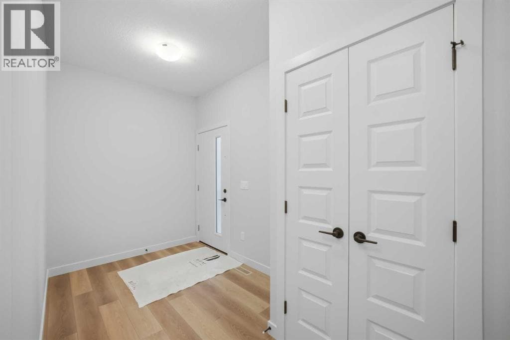 Single Family at 117 Topaz Place, Cochrane, Alberta - Photo 5 - RE/MAX Garden City Realty